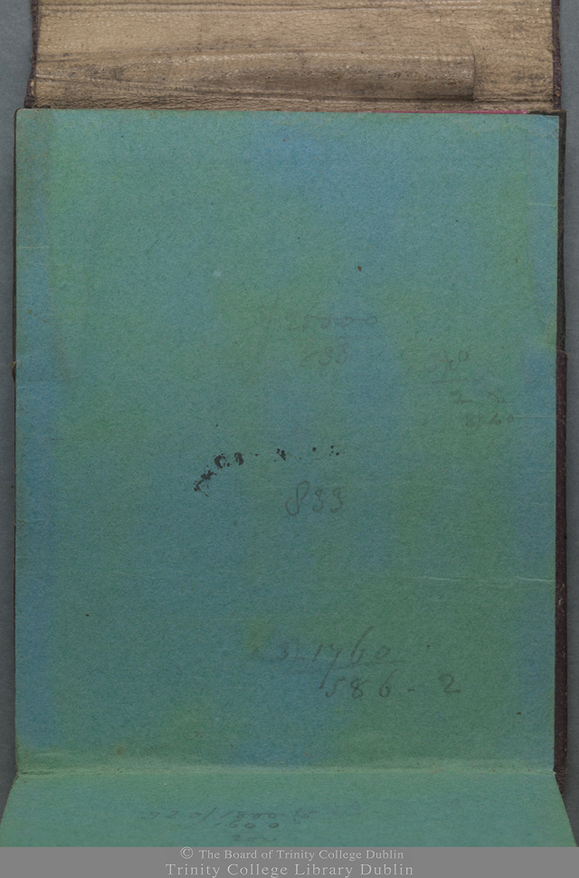 Green paper with some handwritten numbers scrawled on it. Soriases written in cover.