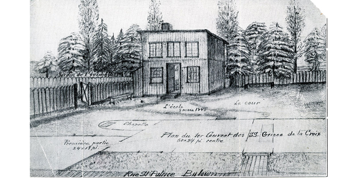 Black and white illustration of two storey building, flat roof, five windows and open door on front wall, picket fence and trees in background.